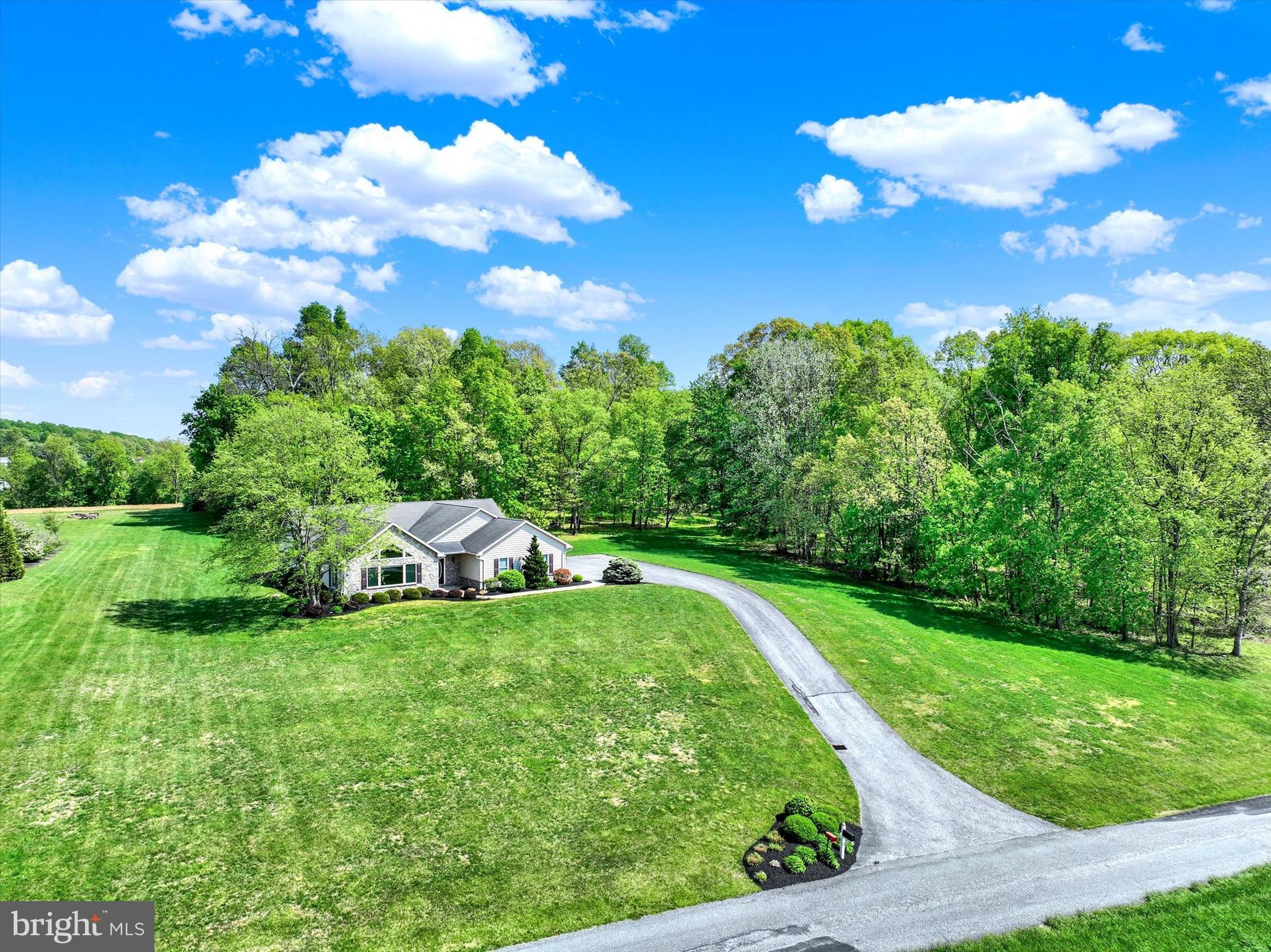a view of a house with a backyard