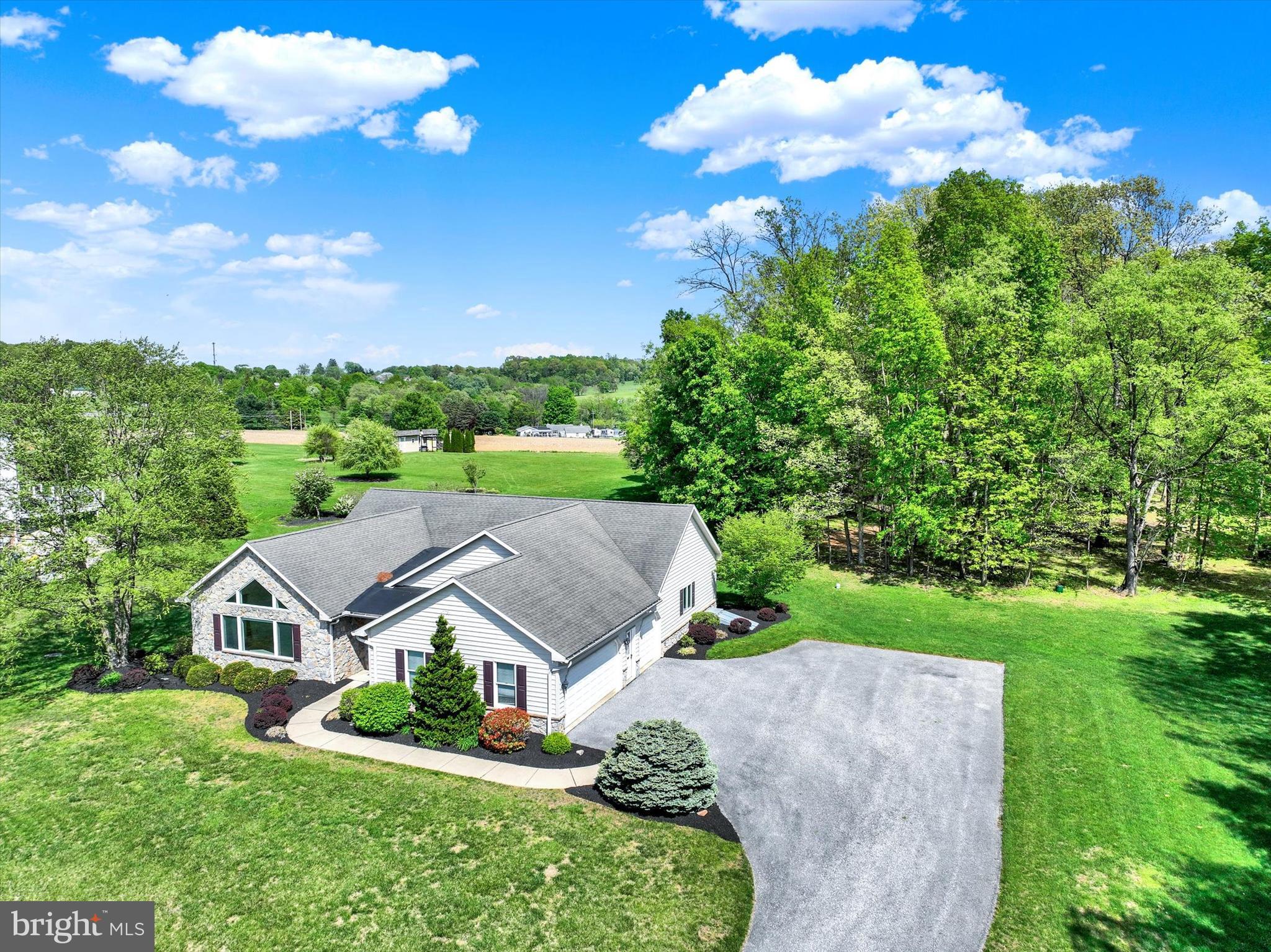 4192 Evergreen Road Felton, PA 17322 - Photo 13 of 46 a view of a house with a big yard plants and large trees