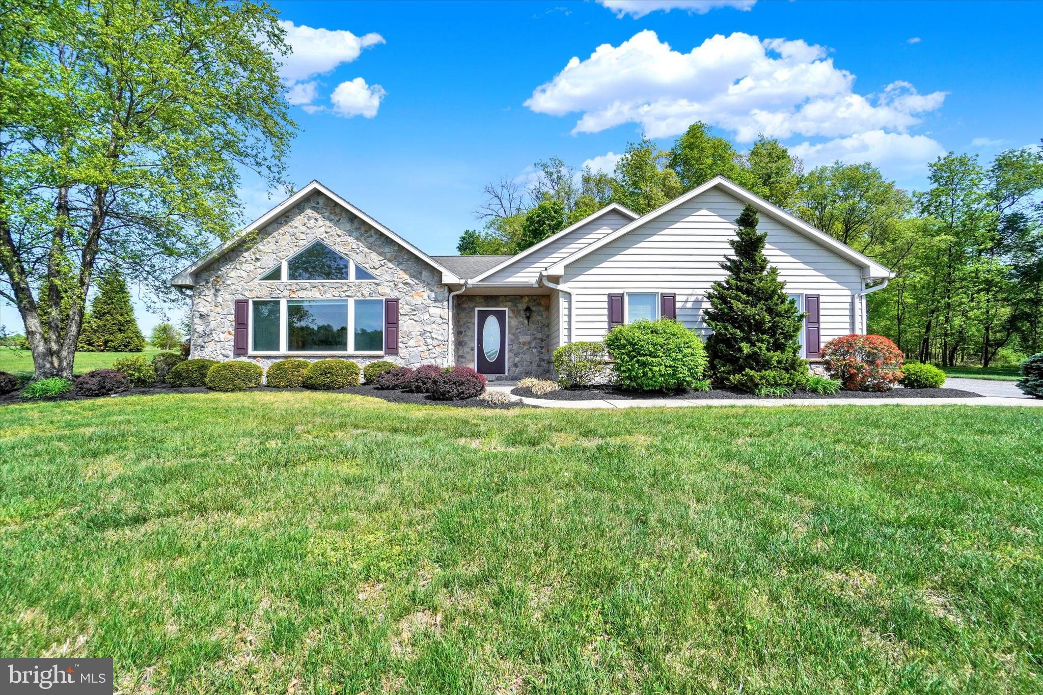 4192 Evergreen Road Felton, PA 17322 - Photo 14 of 46 a front view of house with yard and green space