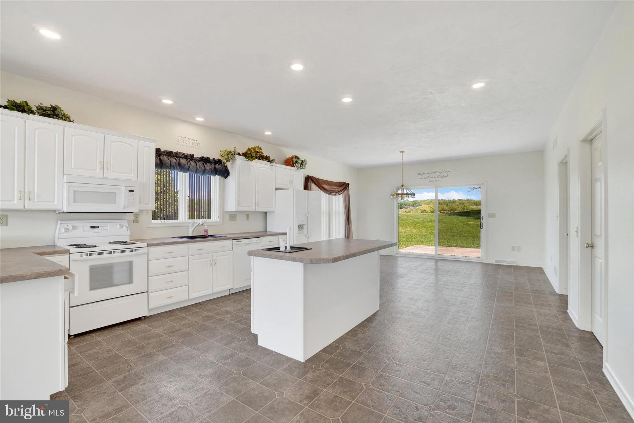 4192 Evergreen Road Felton, PA 17322 - Photo 20 of 46 a kitchen with white cabinets and white appliances