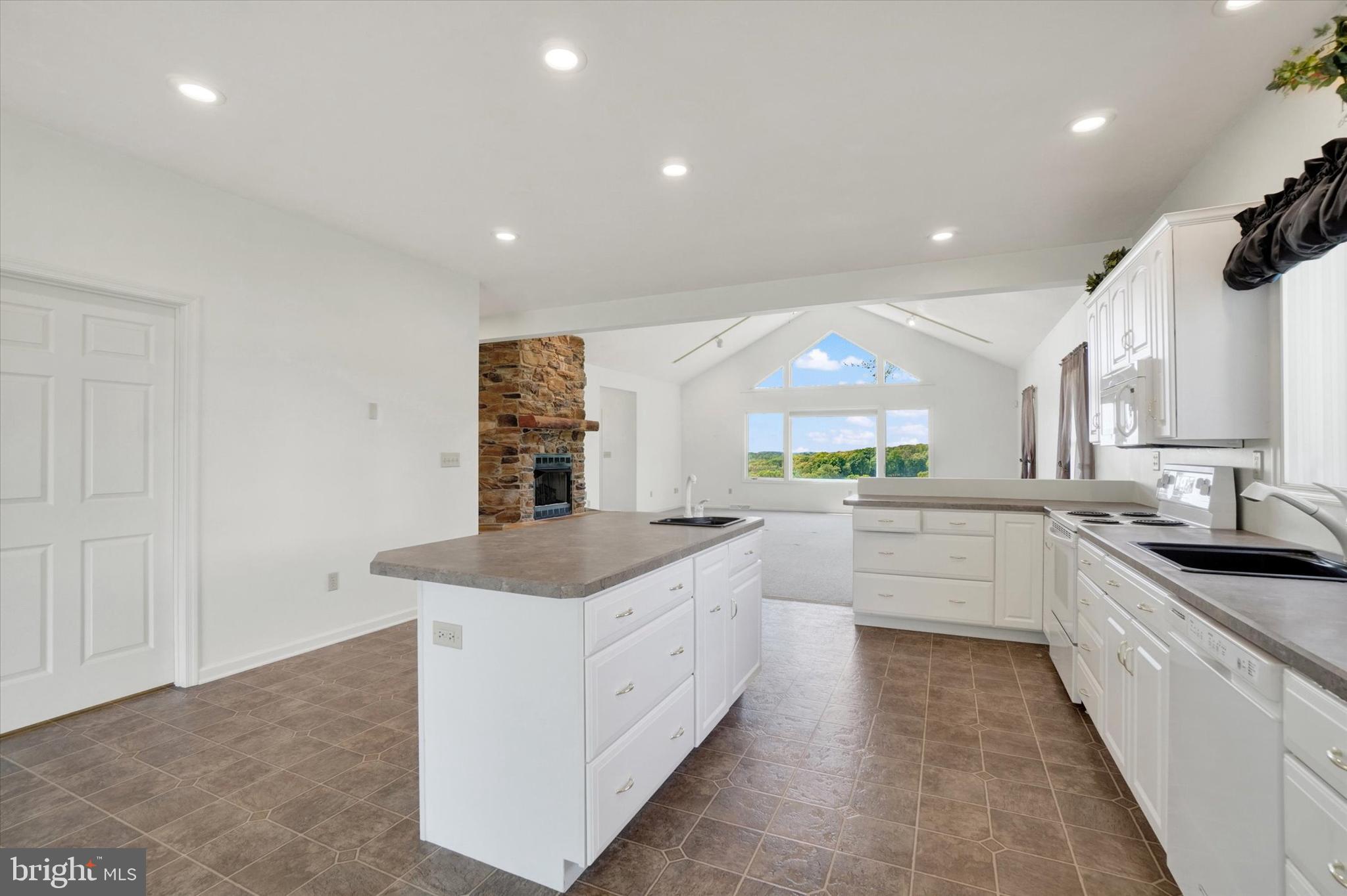 4192 Evergreen Road Felton, PA 17322 - Photo 22 of 46 a kitchen with granite countertop a sink and cabinets