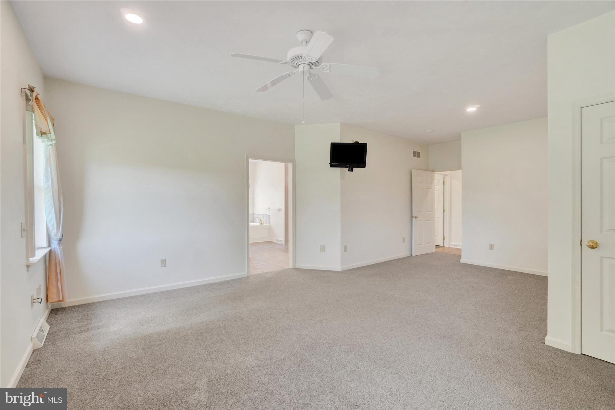 4192 Evergreen Road Felton, PA 17322 - Photo 27 of 46 wooden floor in an empty room with a ceiling fan