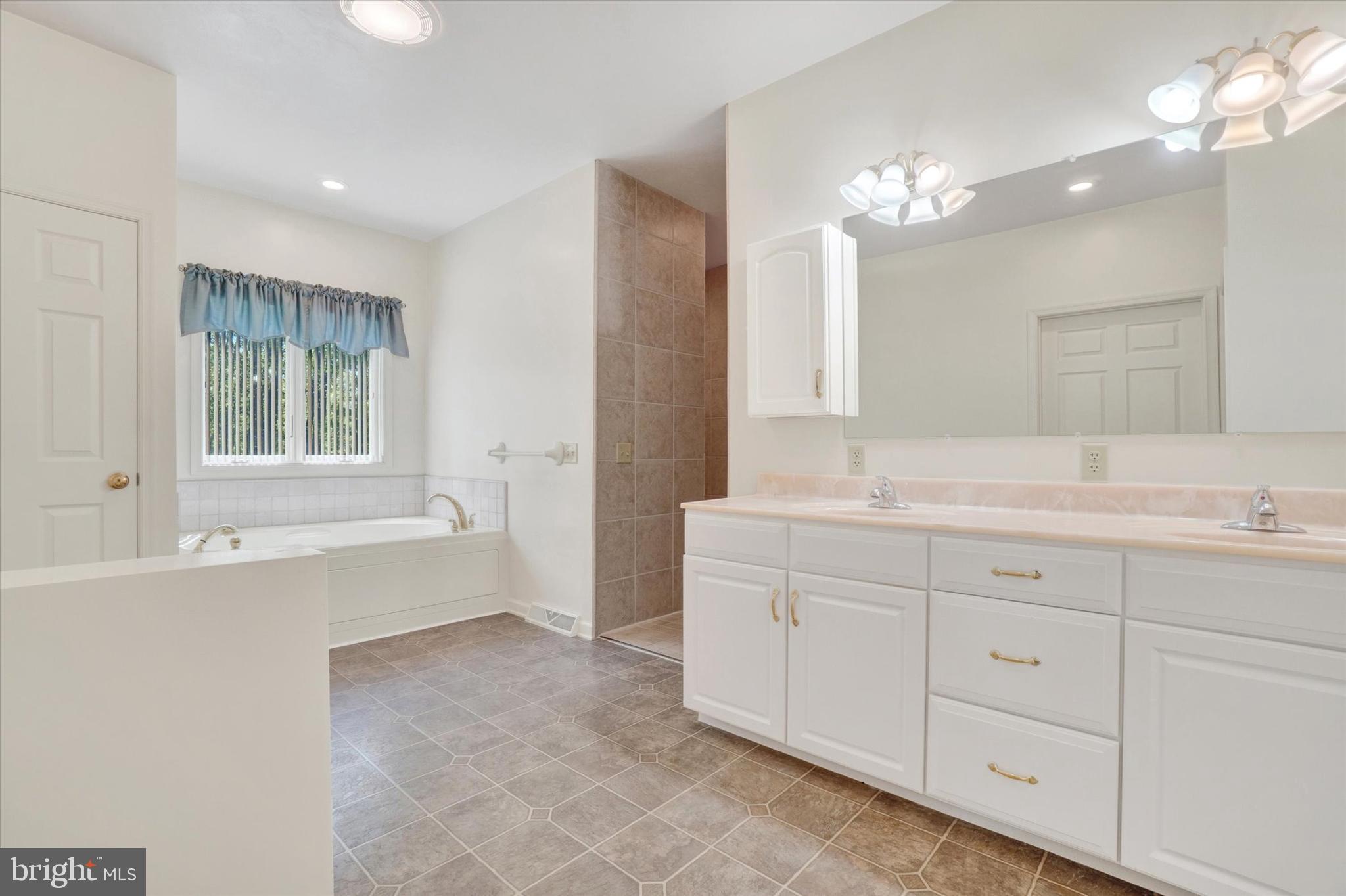 4192 Evergreen Road Felton, PA 17322 - Photo 28 of 46 a bath room with a sink double vanity and a mirror