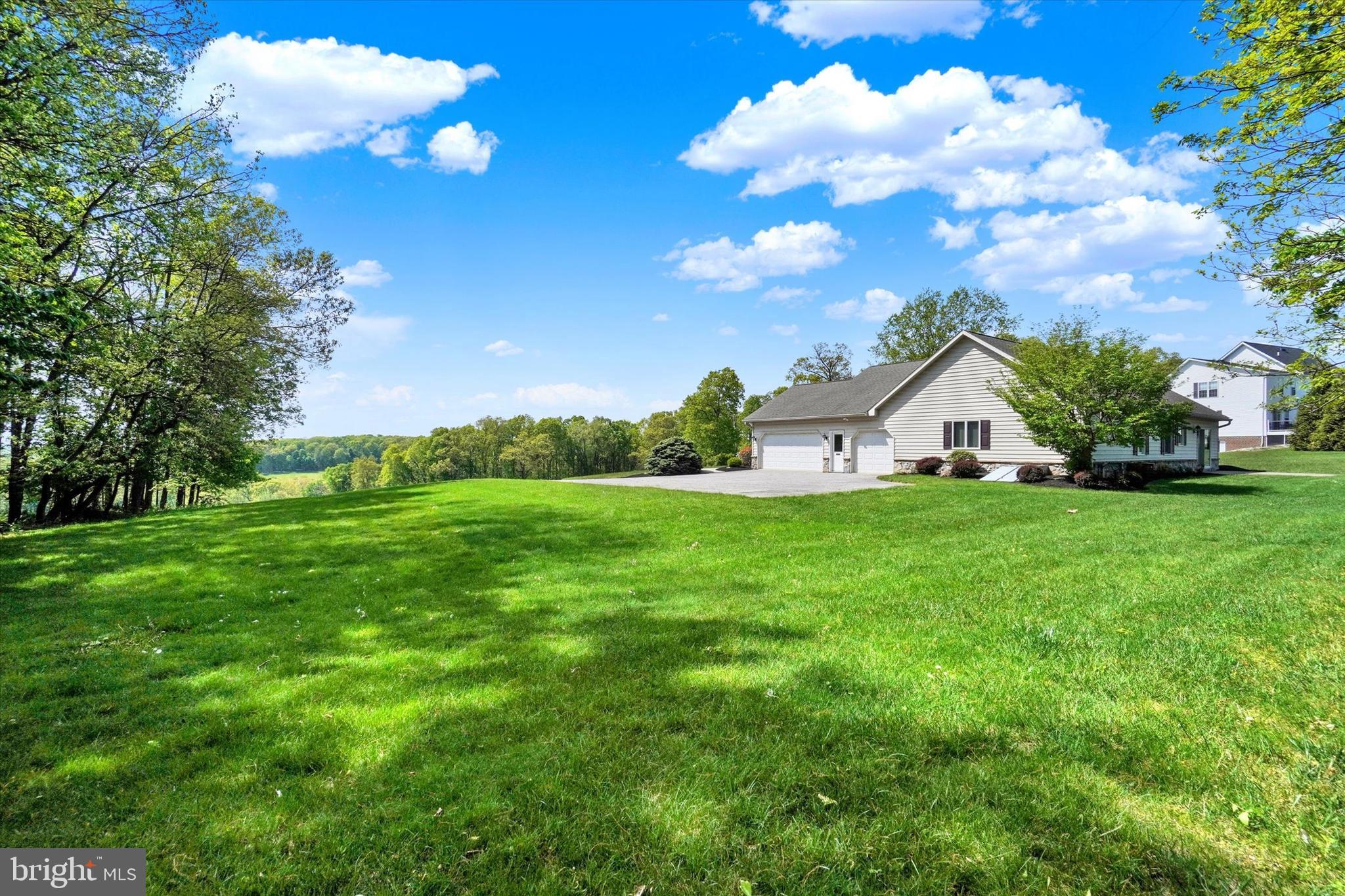 4192 Evergreen Road Felton, PA 17322 - Photo 35 of 46 a view of white house with garden