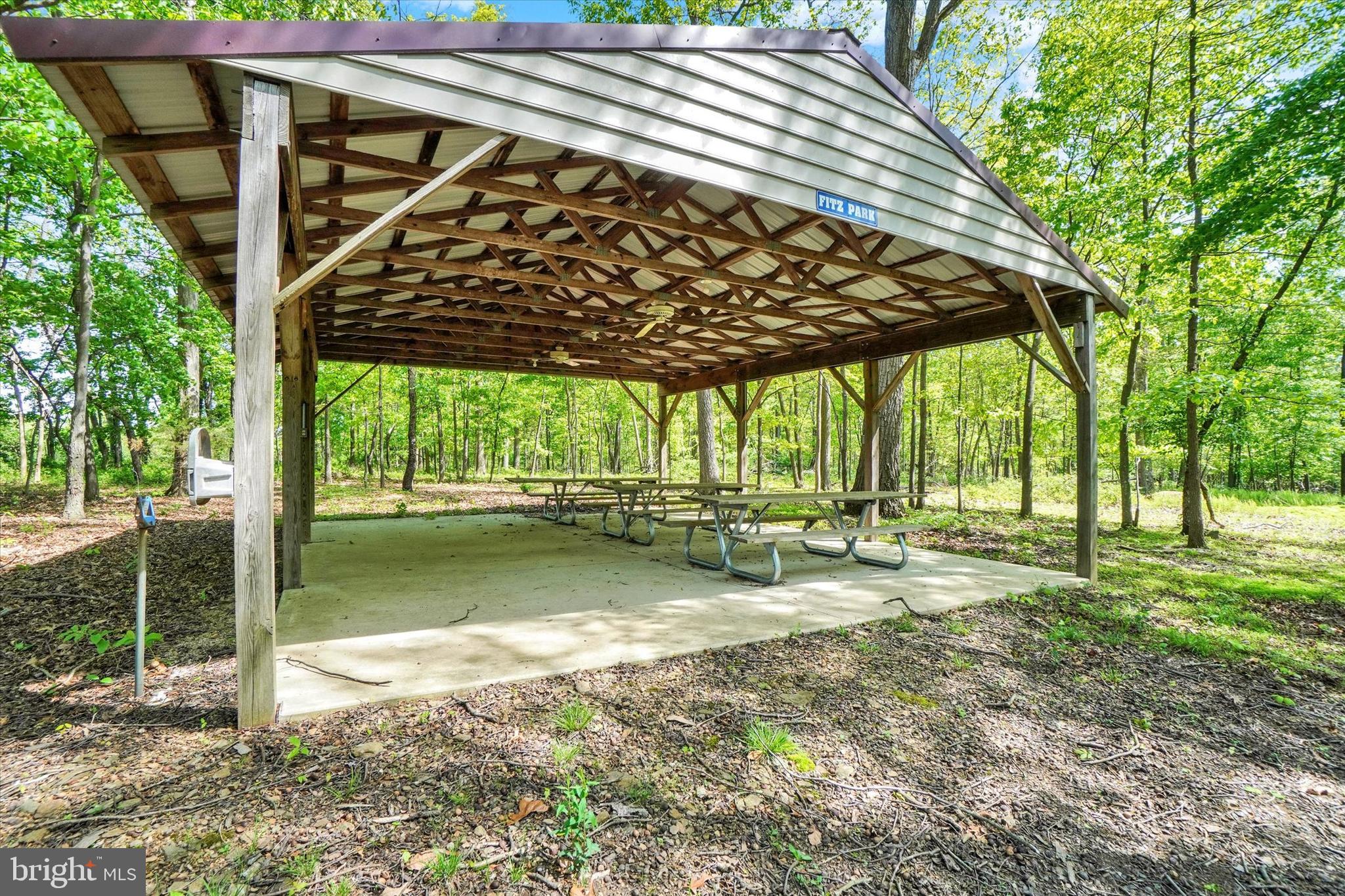 4192 Evergreen Road Felton, PA 17322 - Photo 39 of 46 a view of a backyard with wooden fence and a patio