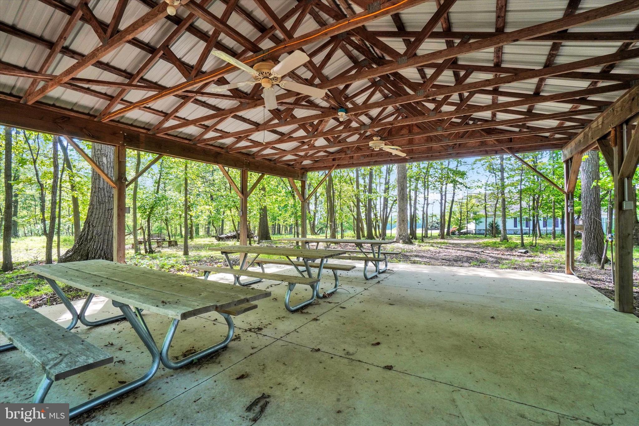 4192 Evergreen Road Felton, PA 17322 - Photo 40 of 46 a swimming pool with lawn chairs and couches with wooden floor
