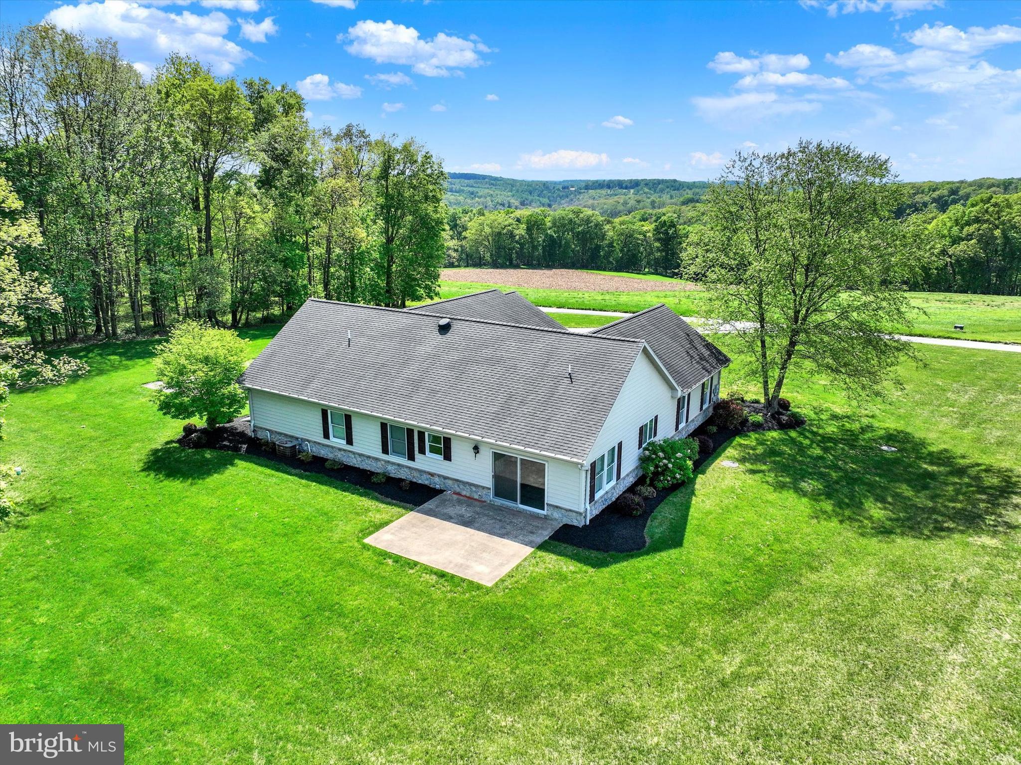 4192 Evergreen Road Felton, PA 17322 - Photo 42 of 46 a view of a house with a big yard and large trees