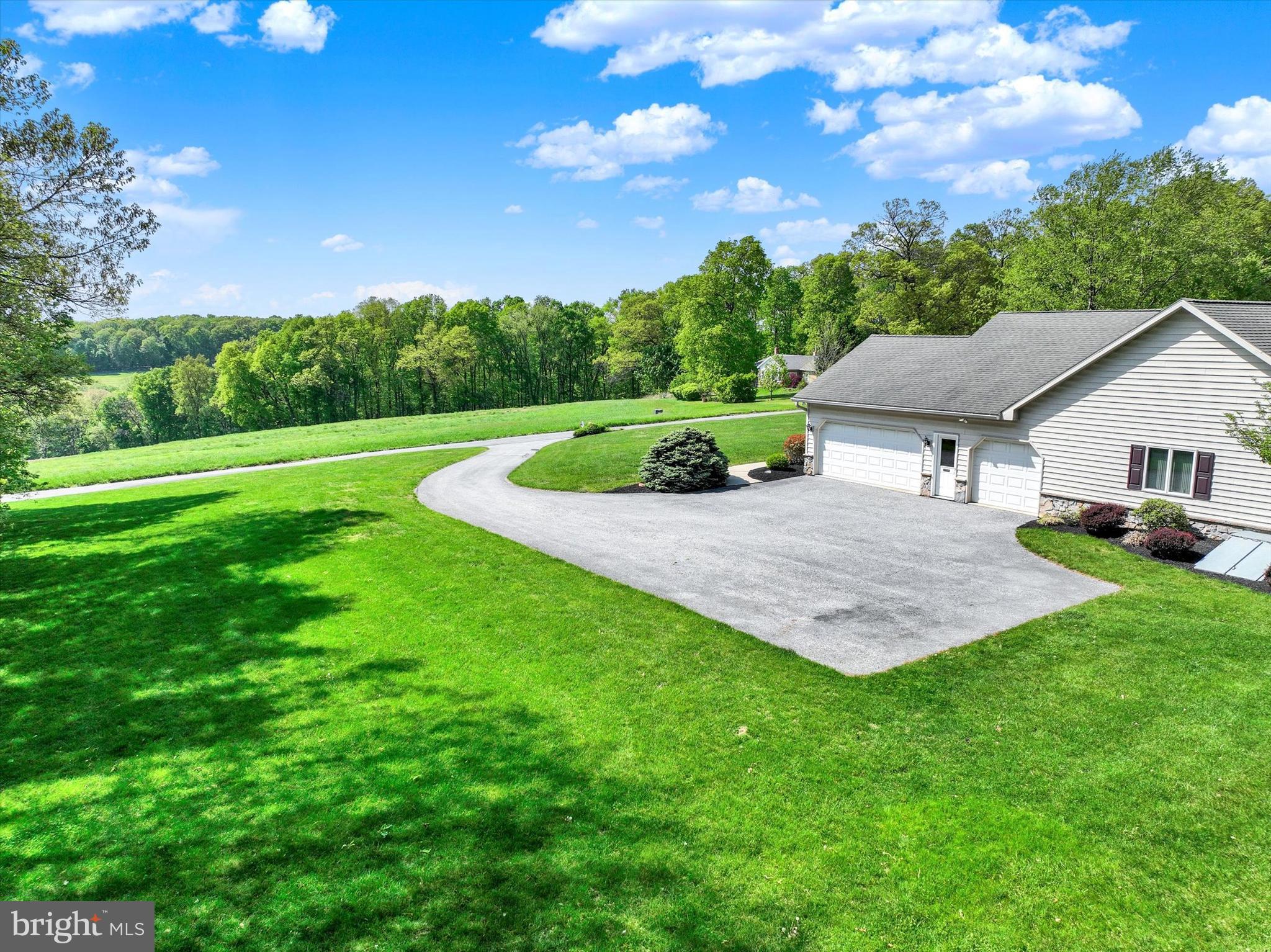 4192 Evergreen Road Felton, PA 17322 - Photo 43 of 46 a view of a house with a backyard and a patio