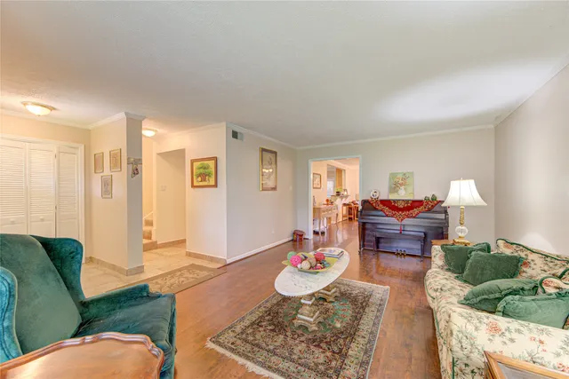 a living room with furniture fireplace and flat screen tv