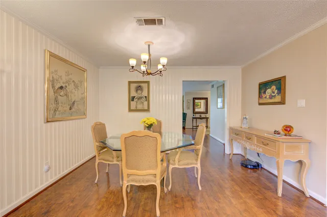 a large kitchen with stainless steel appliances a refrigerator a sink dishwasher with a stove and a refrigerator