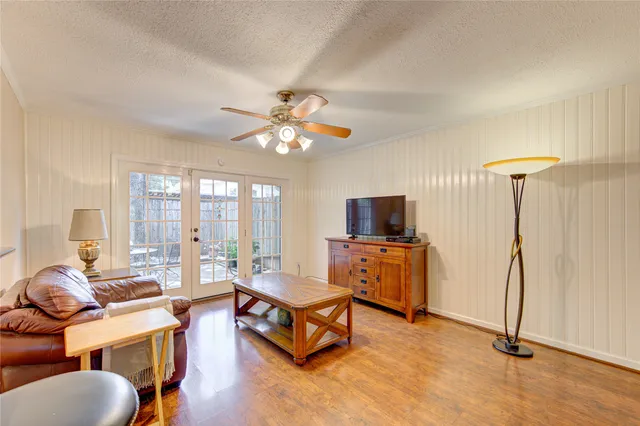 a large kitchen with stainless steel appliances granite countertop a refrigerator and a stove top oven