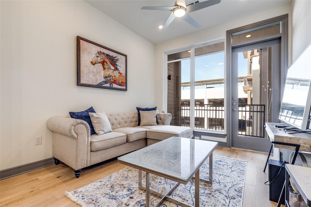 2700 Old Denton Road, Unit 3350 Carrollton, TX 75007 - Photo 1 of 12 a living room with furniture and a large window