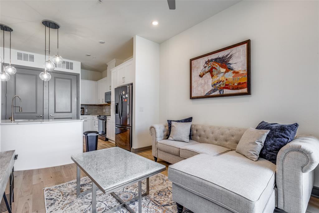 2700 Old Denton Road, Unit 3350 Carrollton, TX 75007 - Photo 2 of 12 a living room with furniture and kitchen view
