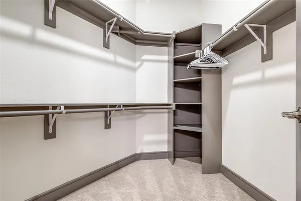 a view of a room with racks on the wall