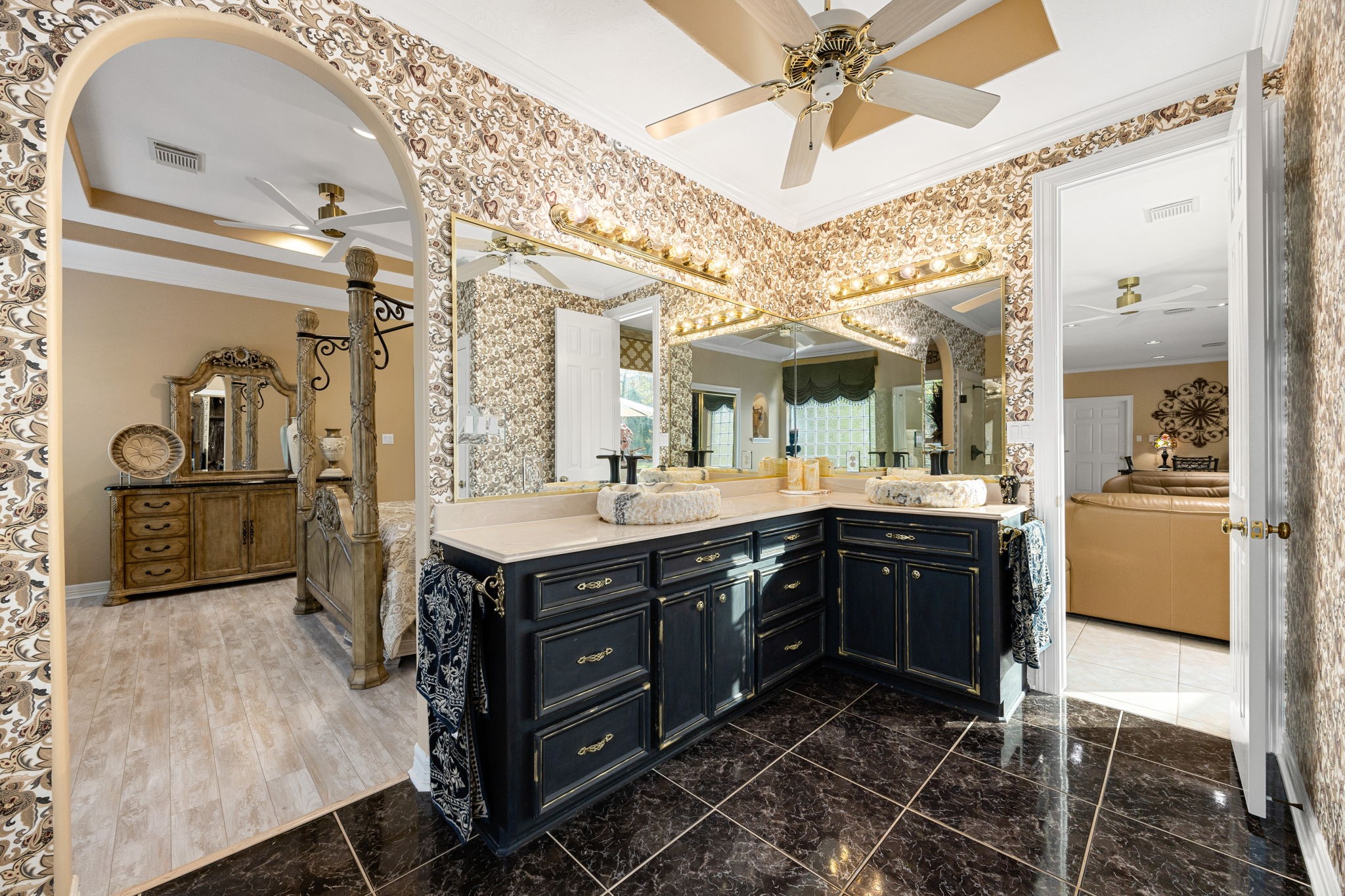 11984 White Oak Crossing Conroe, TX 77385 - Photo 28 of 42 The primary bathroom is adorned with custom cabinet finishes and custom sink hewn from a single piece of onyx