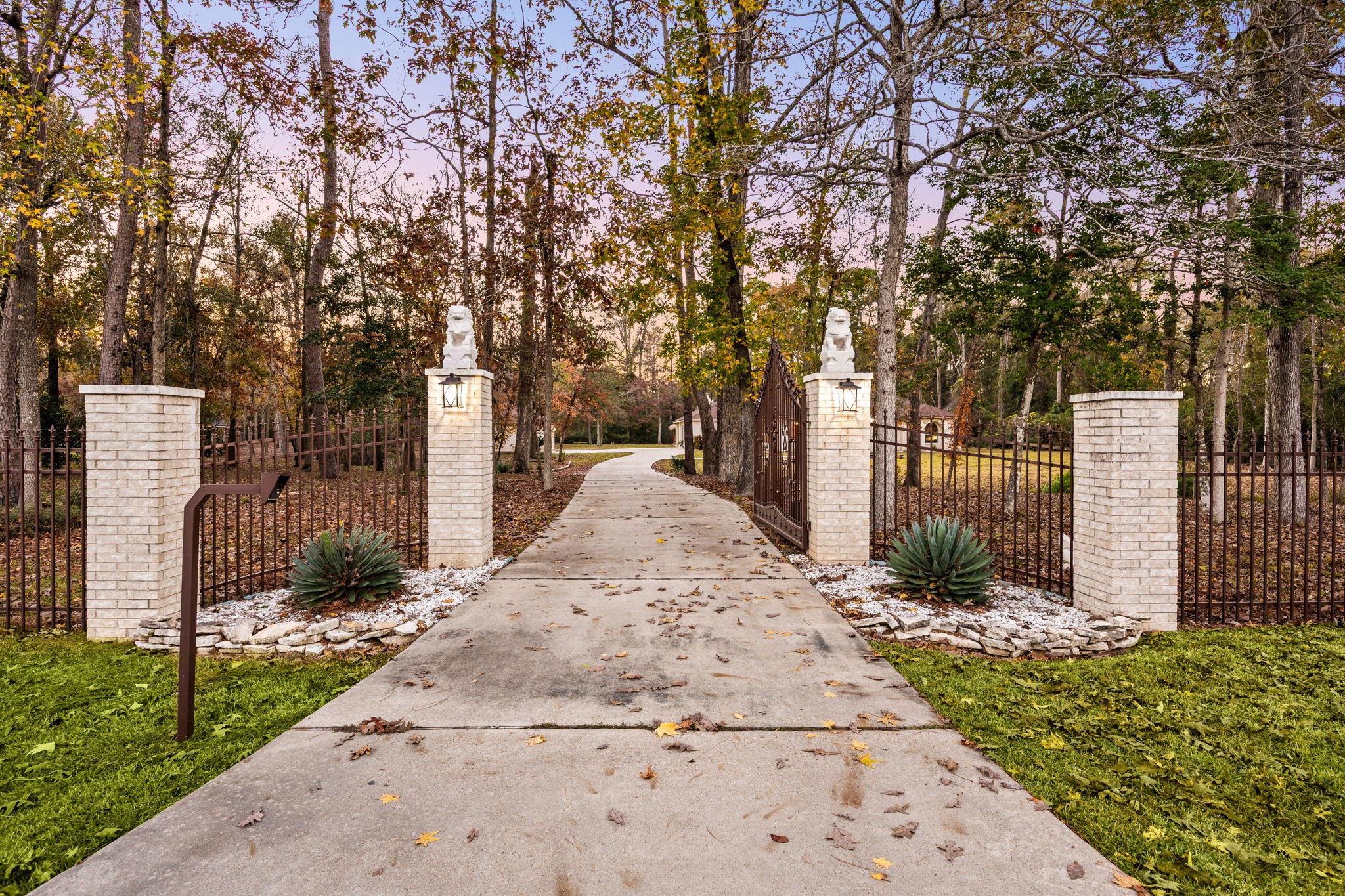 11984 White Oak Crossing Conroe, TX 77385 - Photo 36 of 42 Enjoy privacy and security with this gated entry and 180ft tree-lined driveway