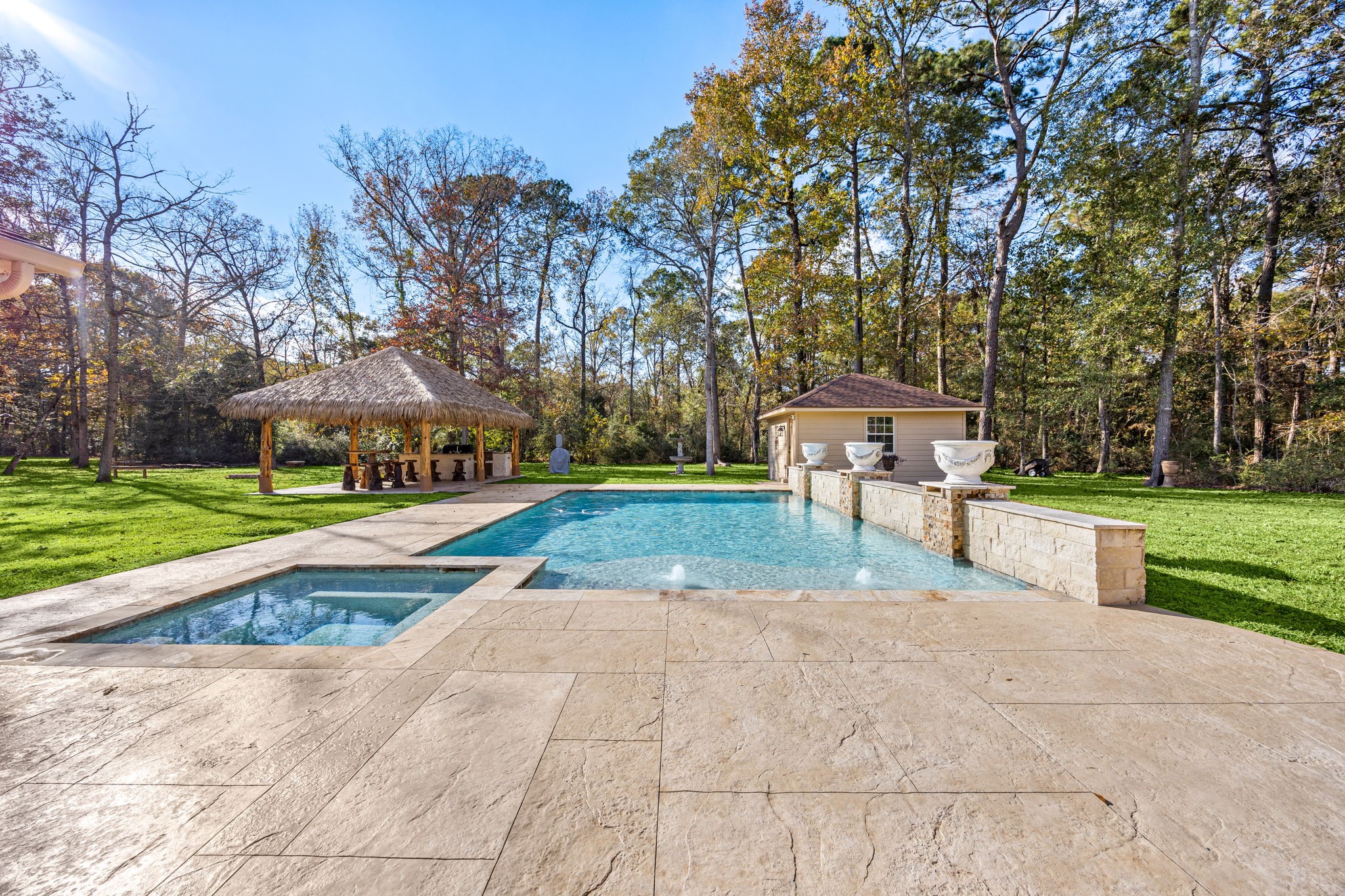 11984 White Oak Crossing Conroe, TX 77385 - Photo 6 of 42 Gorgeous modern style pool with hot tub, waterfall feature, gas firepit and lounge area