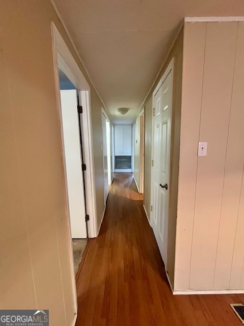 527 Sullivan Road Warner Robins, GA 31093 - Photo 12 of 34 a view of a hallway with wooden floor