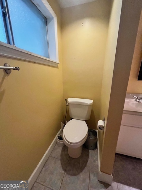 527 Sullivan Road Warner Robins, GA 31093 - Photo 19 of 34 a white toilet sitting next to a sink