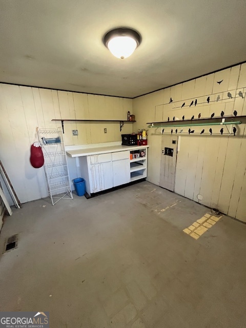 527 Sullivan Road Warner Robins, GA 31093 - Photo 27 of 34 a kitchen with granite countertop white cabinets and white appliances