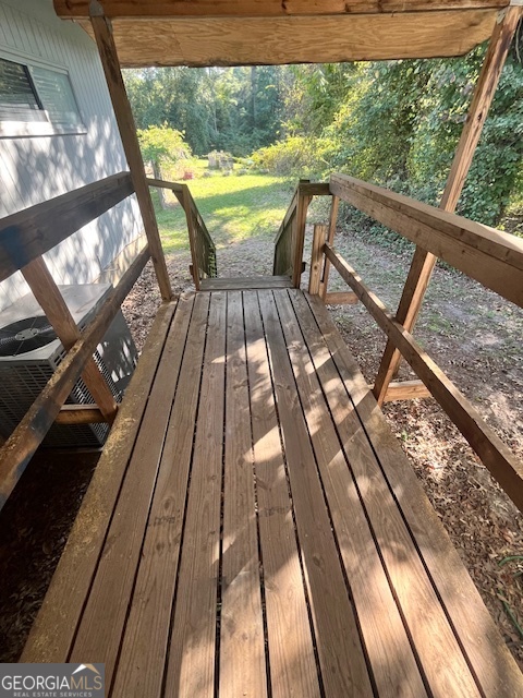527 Sullivan Road Warner Robins, GA 31093 - Photo 31 of 34 a view of balcony with wooden floor