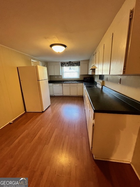 527 Sullivan Road Warner Robins, GA 31093 - Photo 9 of 34 a kitchen with kitchen island a counter top space and a sink