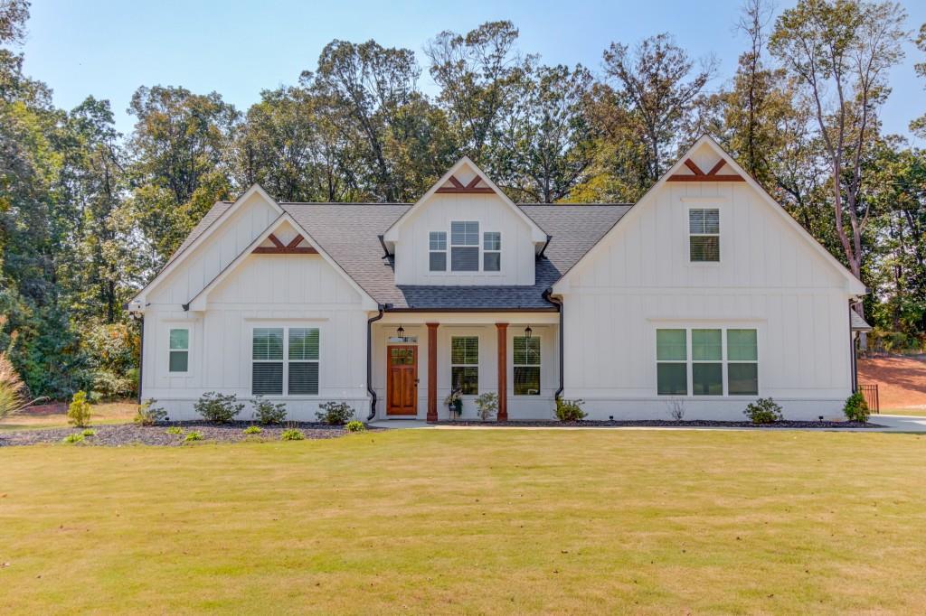 525 Storey Lane Jefferson, GA 30549 - Photo 1 of 45 a front view of a house with a yard