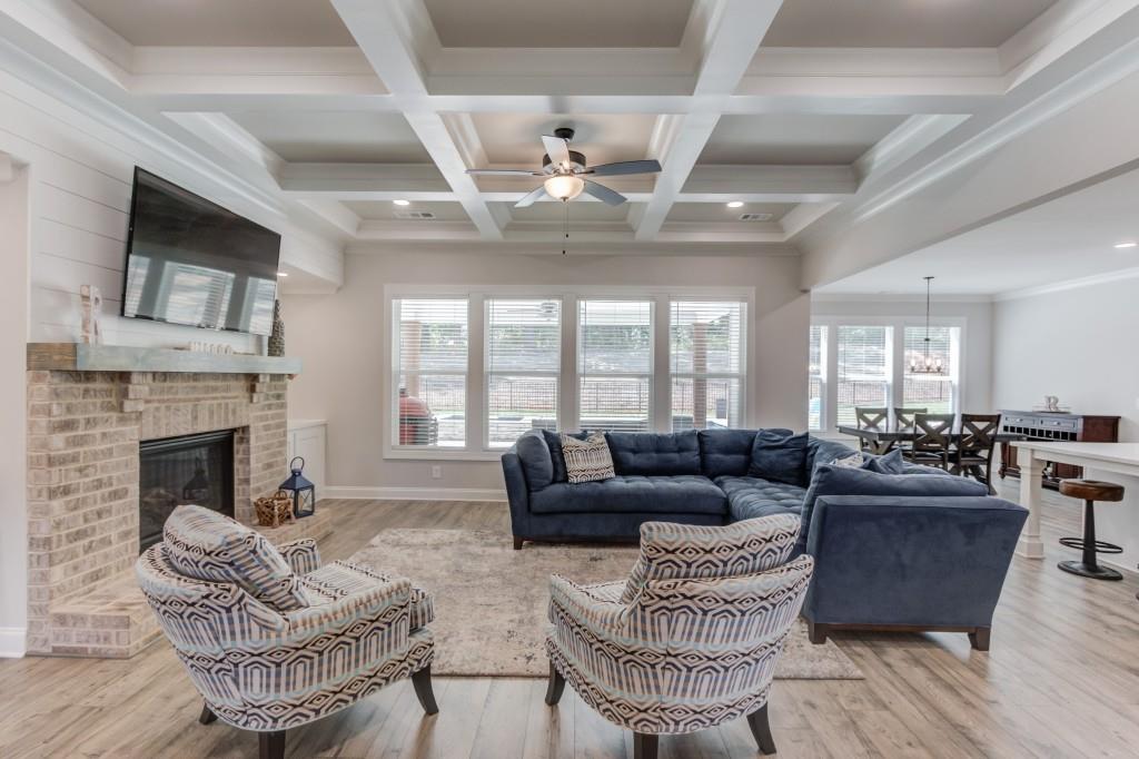 525 Storey Lane Jefferson, GA 30549 - Photo 11 of 45 a living room with furniture fireplace and a large window