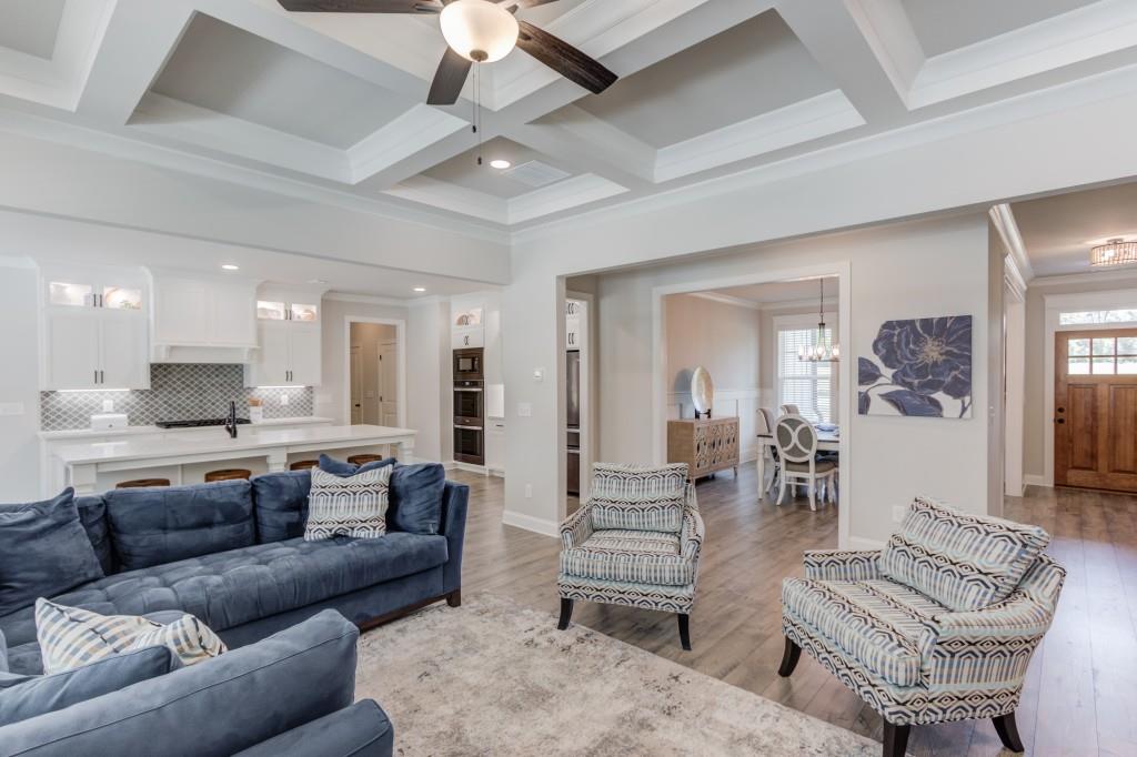 525 Storey Lane Jefferson, GA 30549 - Photo 13 of 45 a living room with furniture kitchen view and a chandelier