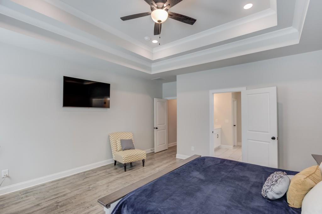 525 Storey Lane Jefferson, GA 30549 - Photo 20 of 45 a living room with furniture and a flat screen tv