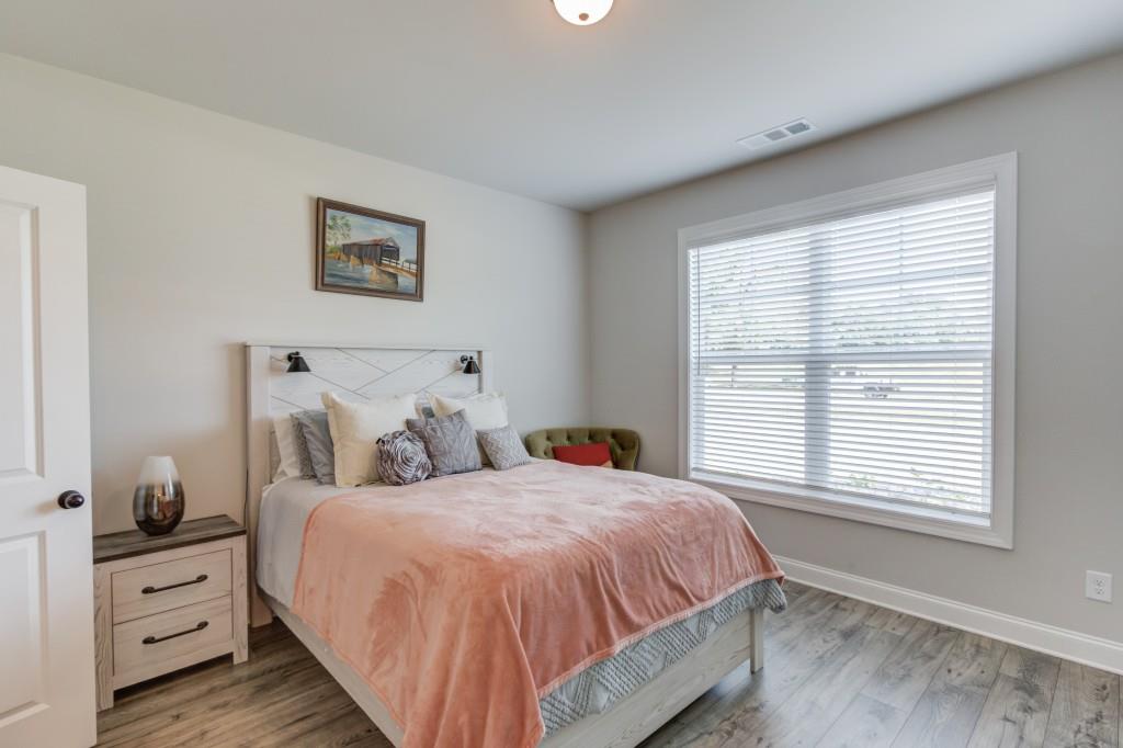 525 Storey Lane Jefferson, GA 30549 - Photo 23 of 45 a bedroom with a bed and a window