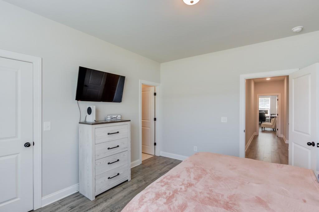 525 Storey Lane Jefferson, GA 30549 - Photo 24 of 45 a view of a bedroom with cabinet and flat screen tv