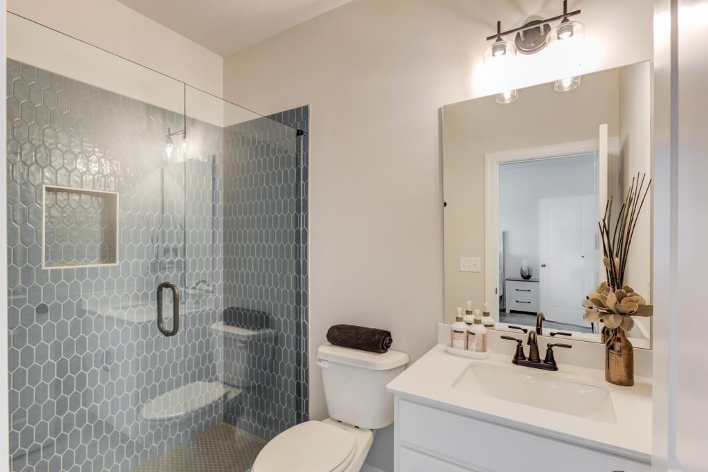 525 Storey Lane Jefferson, GA 30549 - Photo 25 of 45 a bathroom with a sink a toilet and shower