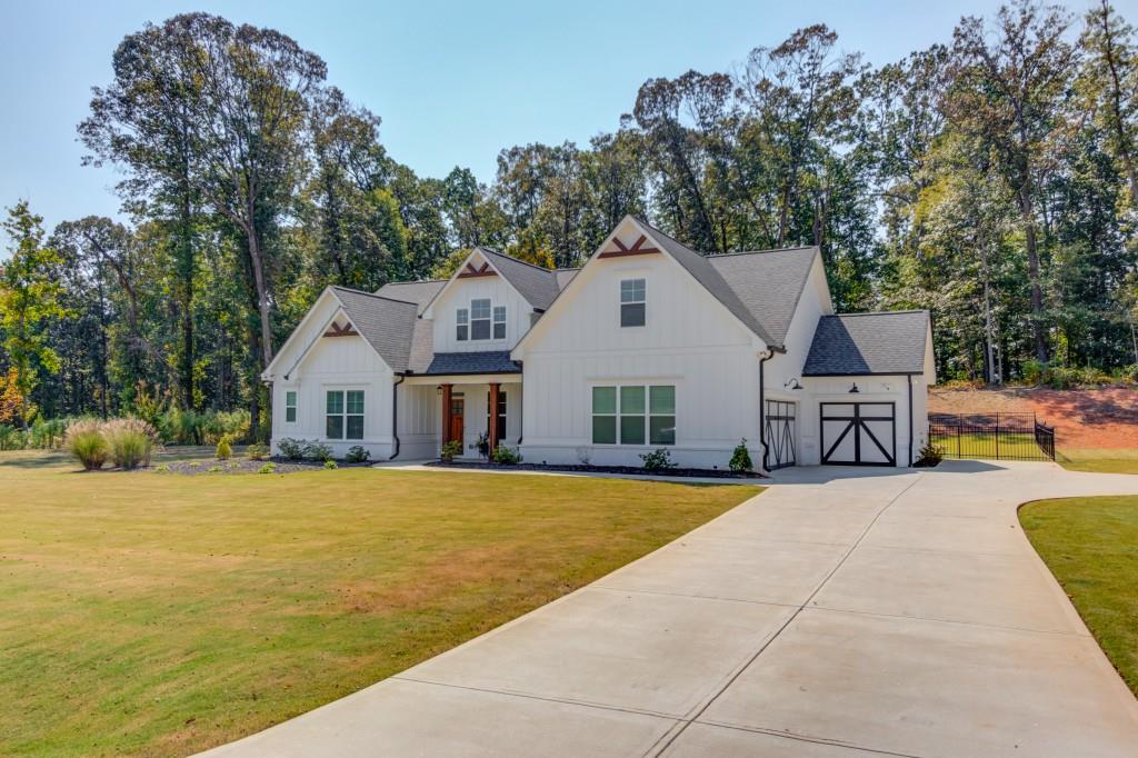 525 Storey Lane Jefferson, GA 30549 - Photo 3 of 45 a view of house with yard outdoor seating and barbeque oven