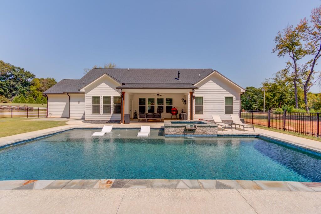 525 Storey Lane Jefferson, GA 30549 - Photo 43 of 45 a front view of a house with swimming pool having outdoor seating