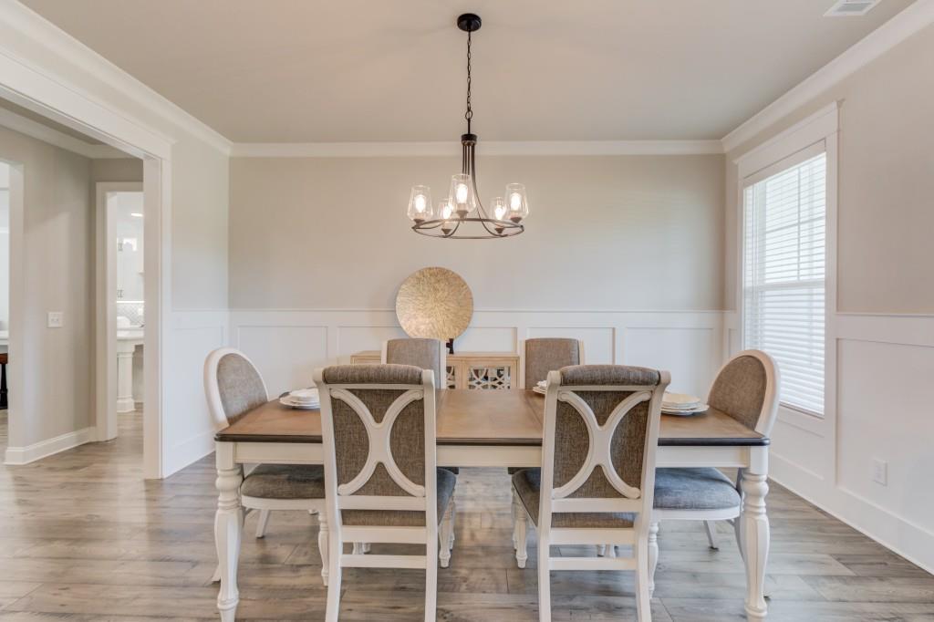 525 Storey Lane Jefferson, GA 30549 - Photo 8 of 45 a view of a dining room with furniture and wooden floor