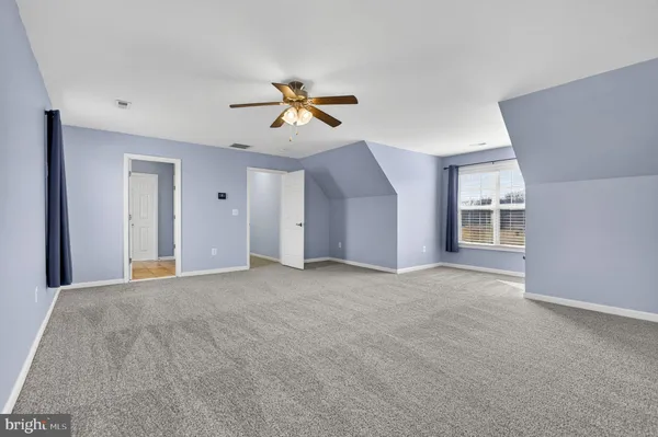a view of a big room with carpet