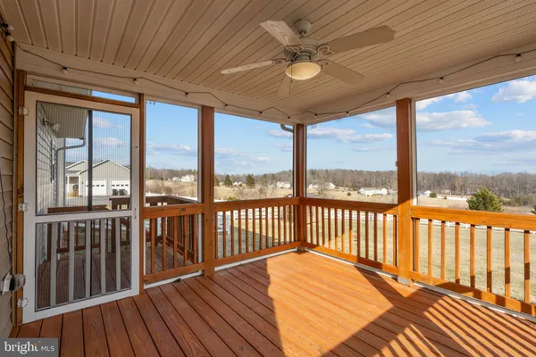 a view of a balcony with furniture