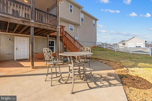 a view of a swimming pool with an outdoor seating