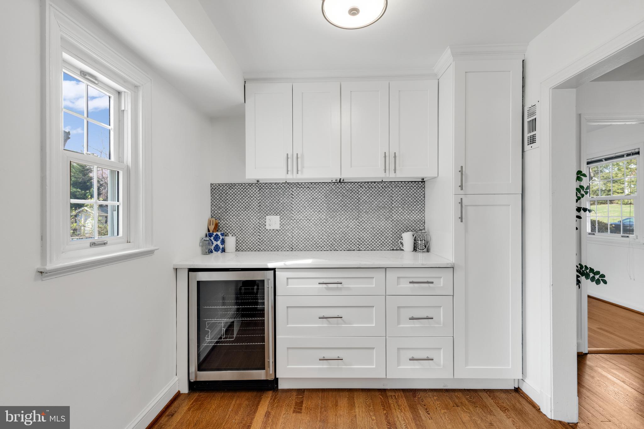 314 Whitestone Road Silver Spring, MD 20901 - Photo 11 of 36 a kitchen with stainless steel appliances granite countertop a stove and a white cabinets