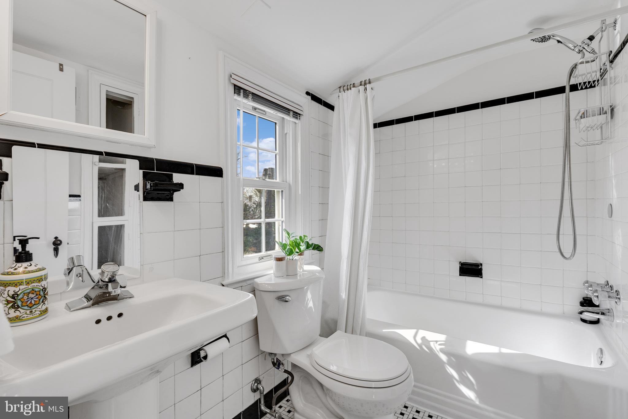 314 Whitestone Road Silver Spring, MD 20901 - Photo 22 of 35 a bathroom with a sink toilet and shower