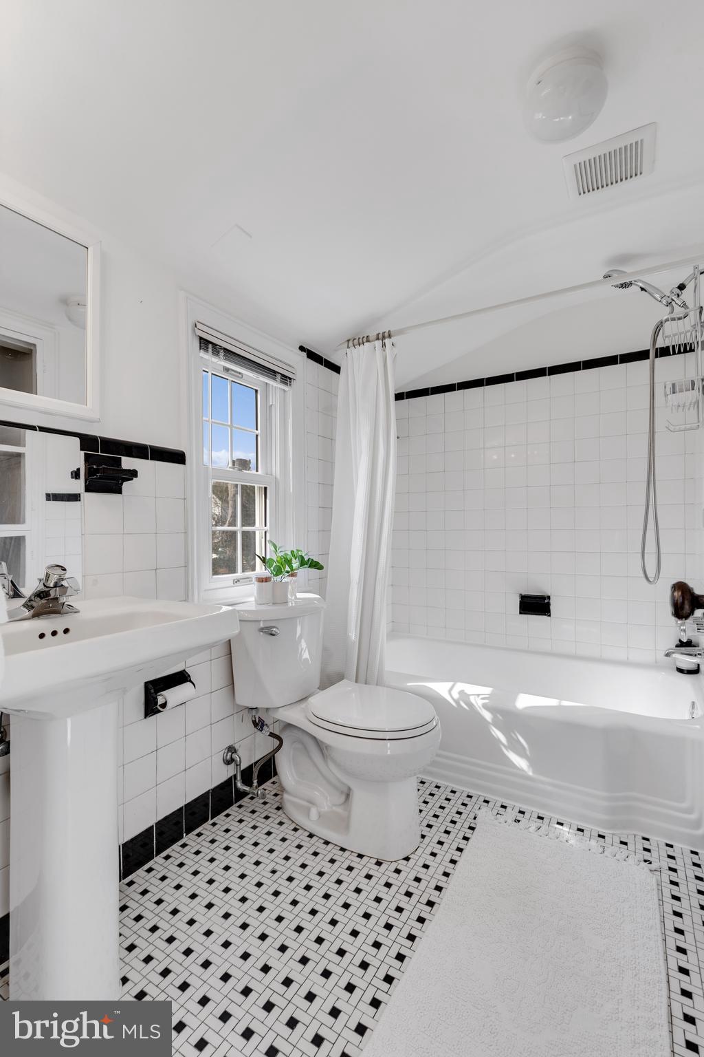 314 Whitestone Road Silver Spring, MD 20901 - Photo 23 of 35 a bathroom with a sink toilet a shower and a mirror