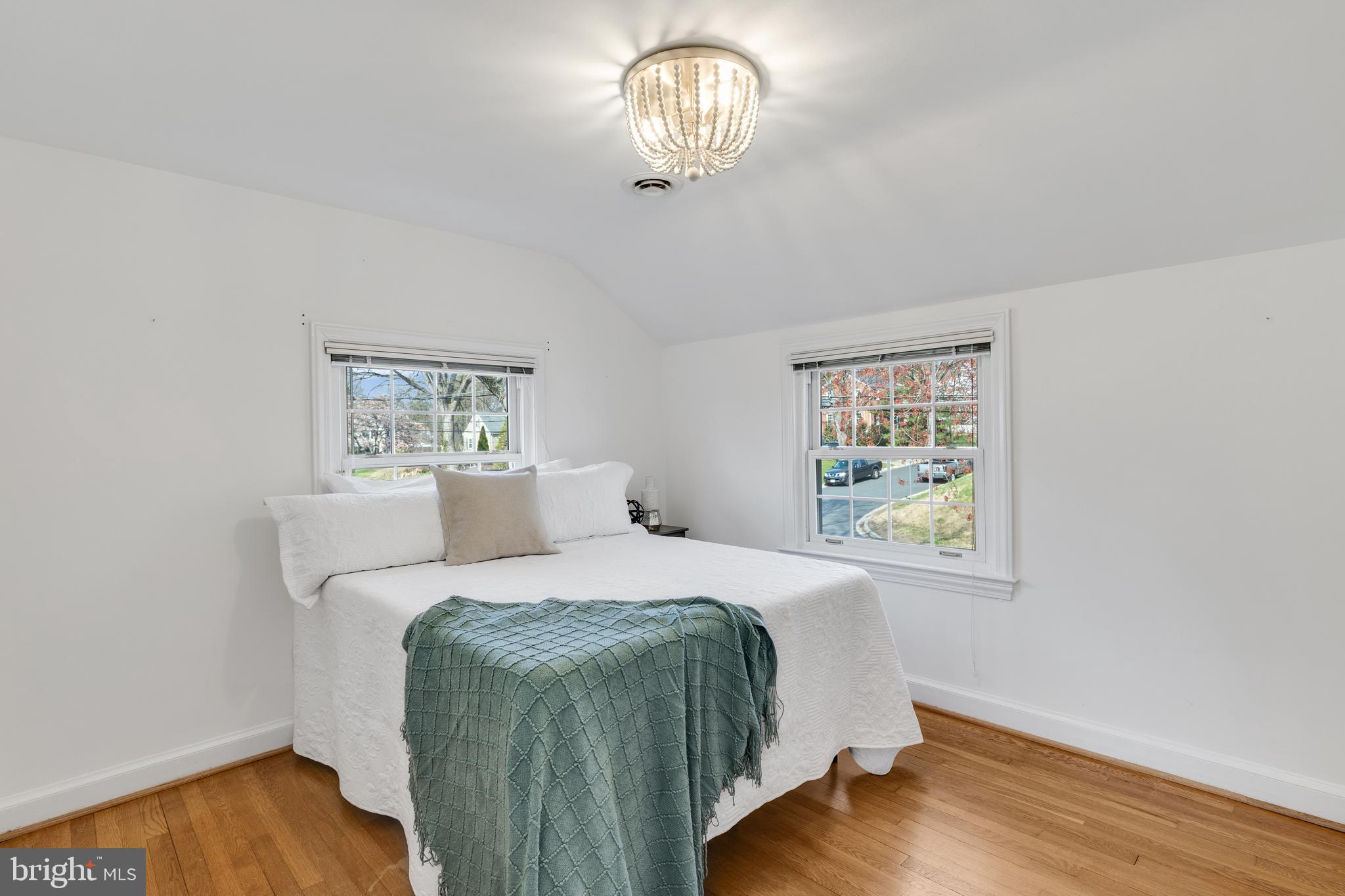 314 Whitestone Road Silver Spring, MD 20901 - Photo 25 of 36 a bedroom with a bed and wooden floor