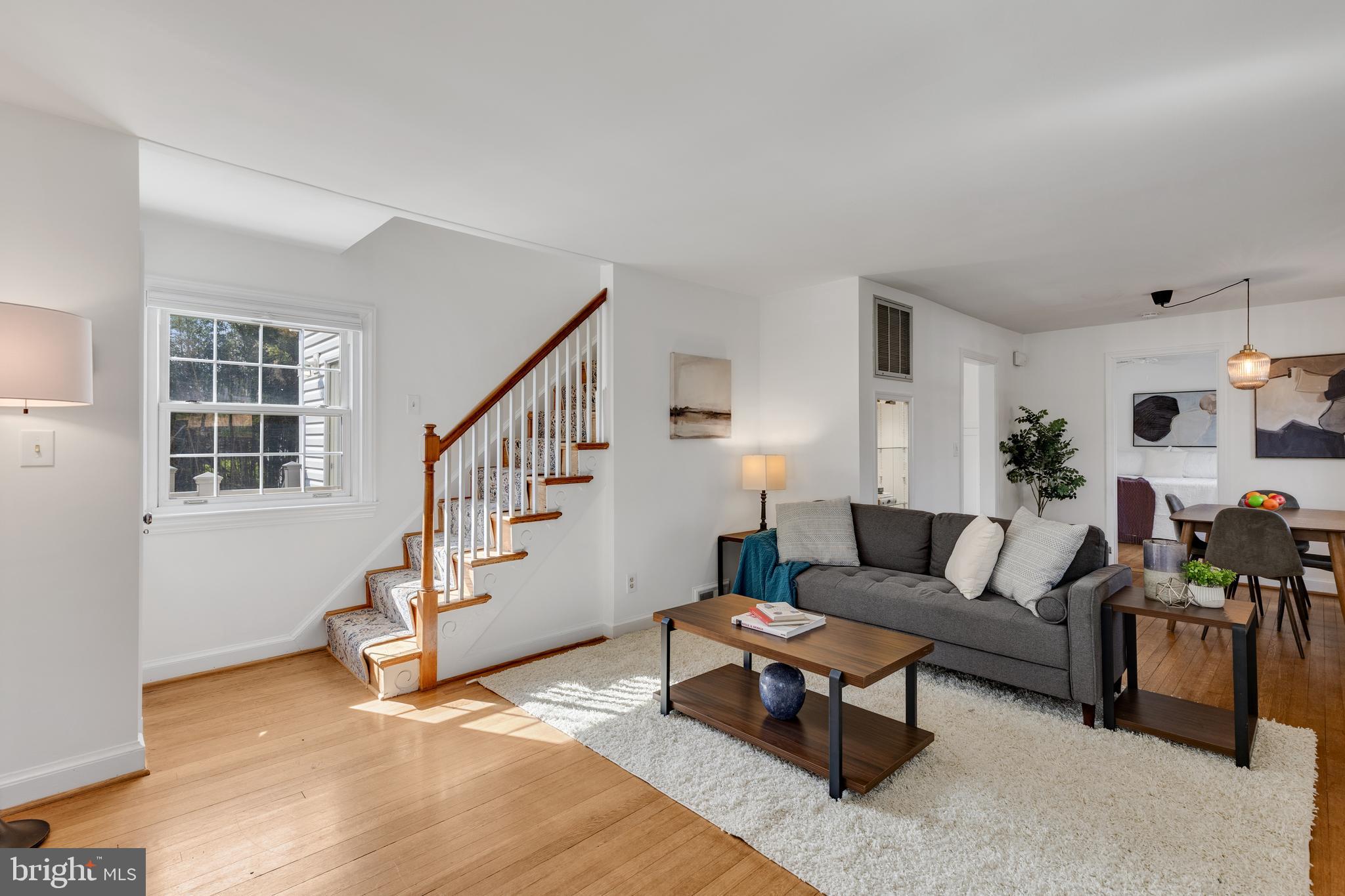 314 Whitestone Road Silver Spring, MD 20901 - Photo 3 of 36 a living room with furniture and wooden floor