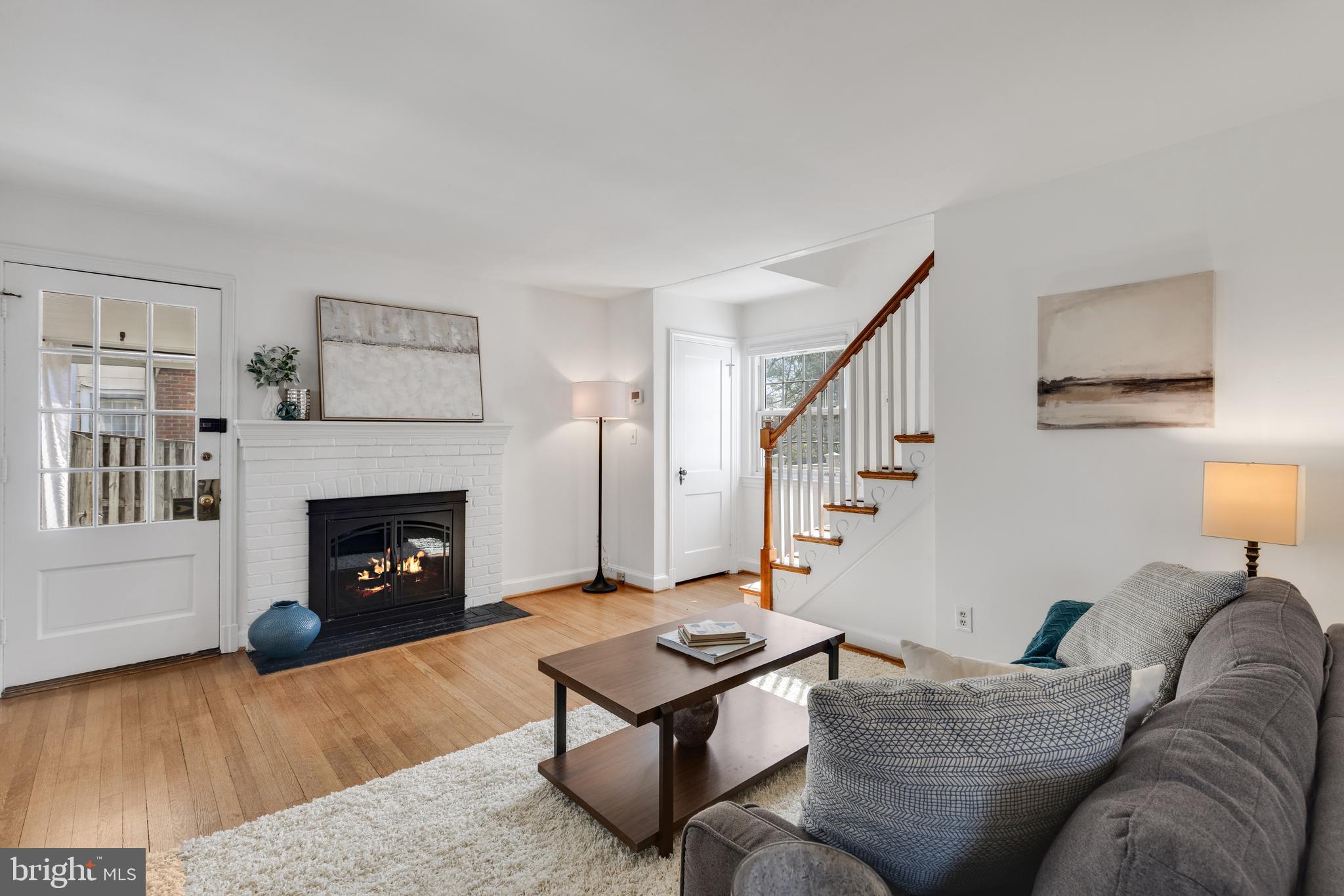 314 Whitestone Road Silver Spring, MD 20901 - Photo 4 of 36 a living room with furniture and a fireplace