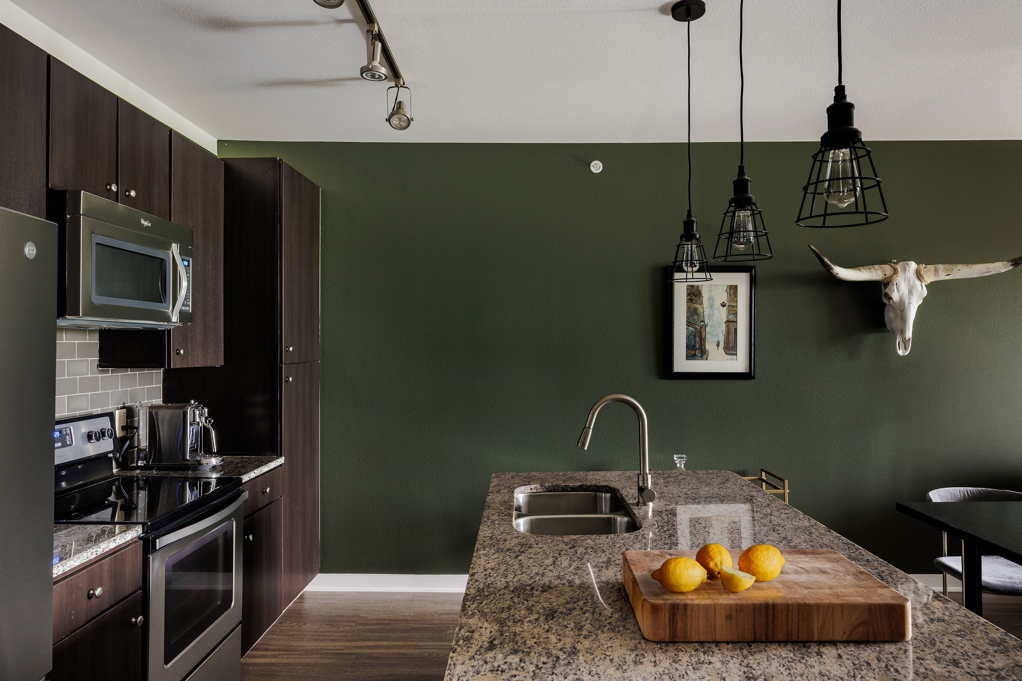 1900 Barton Springs Road, Unit 3028 Austin, TX 78704 - Photo 11 of 31 a kitchen with sink and stainless steel appliances