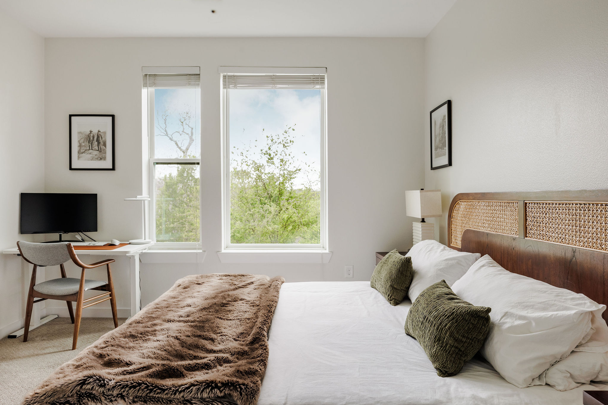 1900 Barton Springs Road, Unit 3028 Austin, TX 78704 - Photo 16 of 31 a bedroom with a bed and a flat tv screen on the dresser