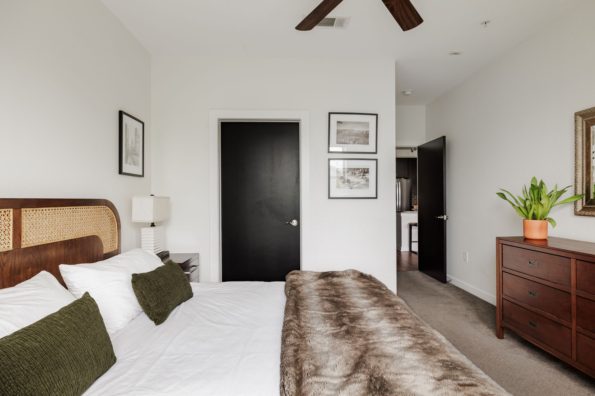 1900 Barton Springs Road, Unit 3028 Austin, TX 78704 - Photo 18 of 31 a bedroom with a bed and a television