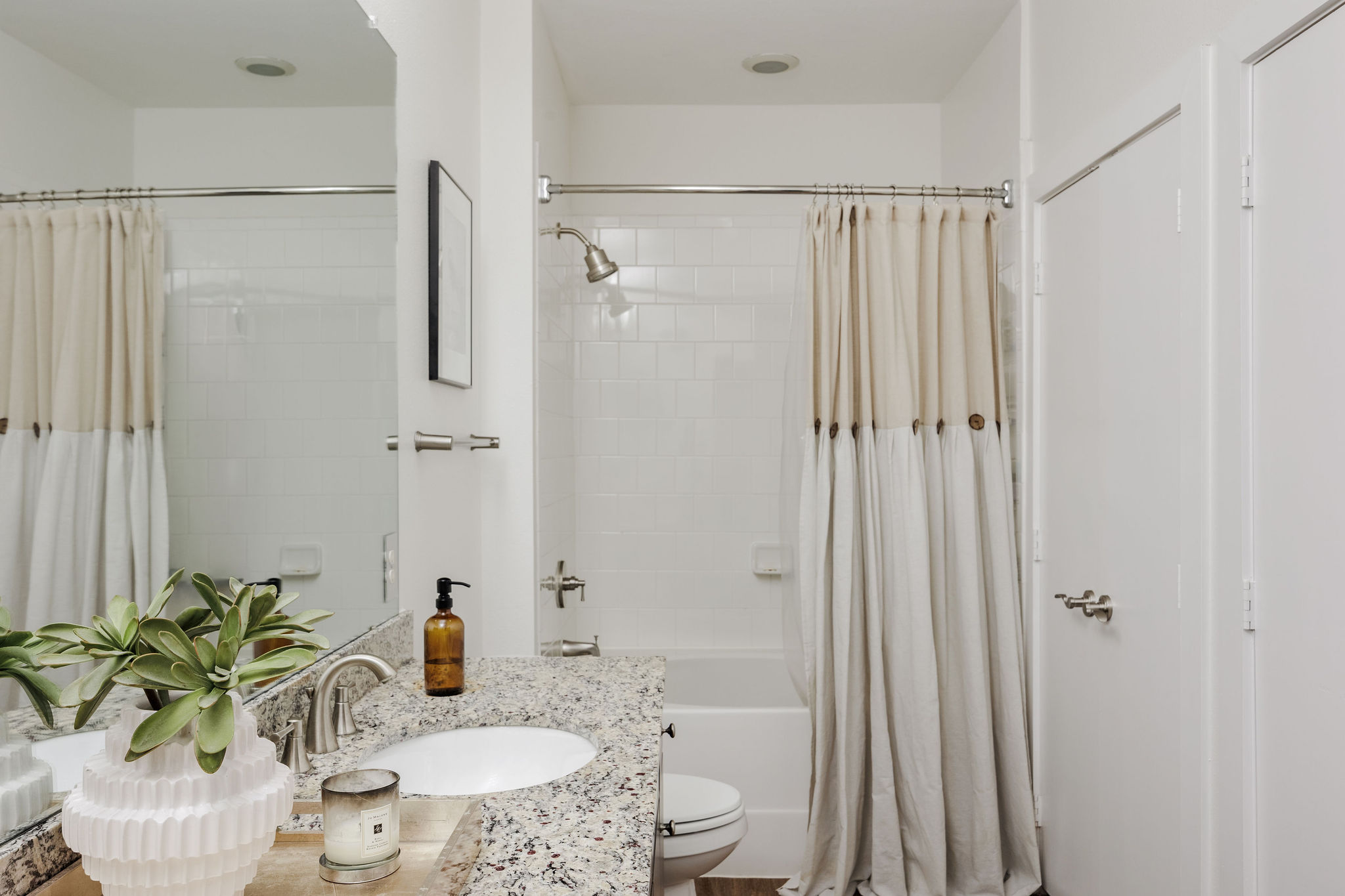 1900 Barton Springs Road, Unit 3028 Austin, TX 78704 - Photo 20 of 31 a bath room with a sink and a mirror