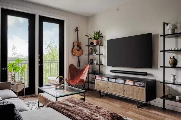 a living room with furniture and a flat screen tv